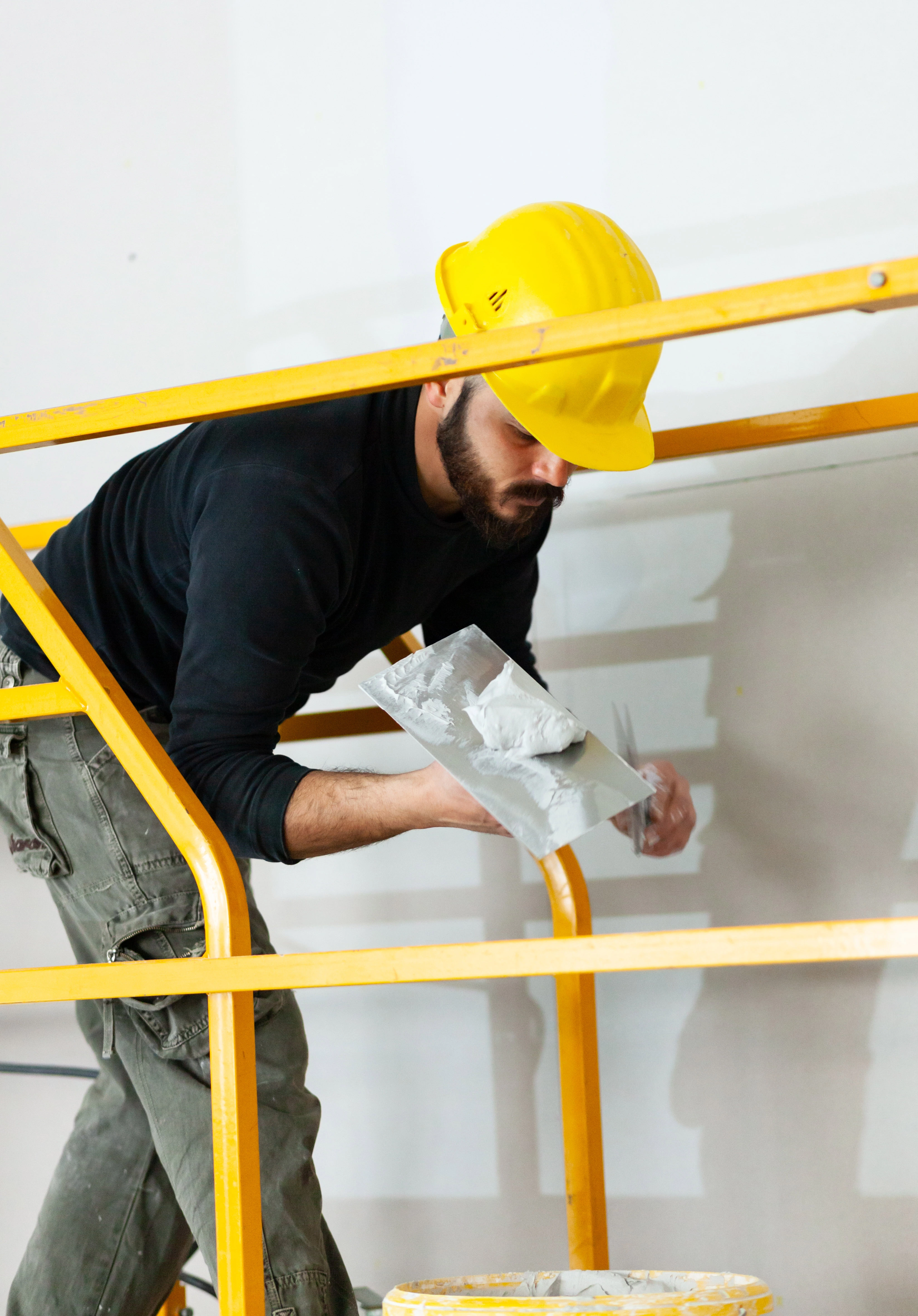 Worker applying plaster